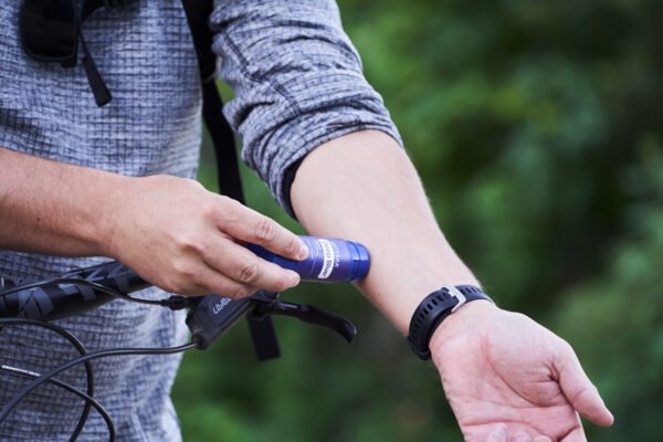 Man applying doTERRA deep blue stick on forarm big